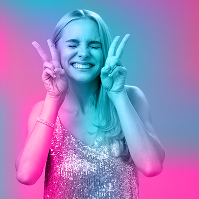 Excited carefree happy cheerful european blond woman have fun drink cocktails dancing partying nightclub girlfriend smiling closed eyes show peace bunny gesture red background Testimonial